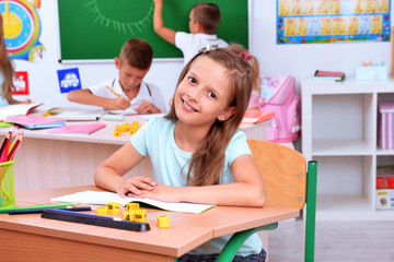 Children at the desks in classroom