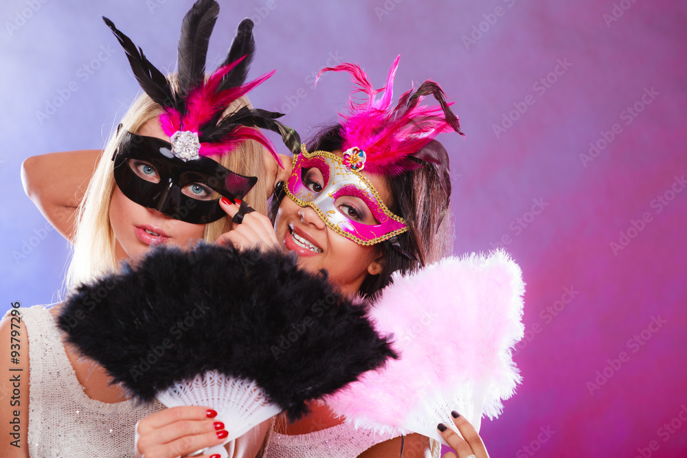 Wall mural Two women with carnival venetian masks