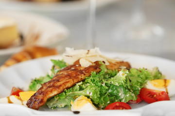 Tasty salad with served wine, close up