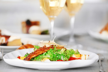 Tasty salad with served wine