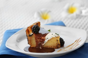 Delicious cake under chocolate glaze with blackberry