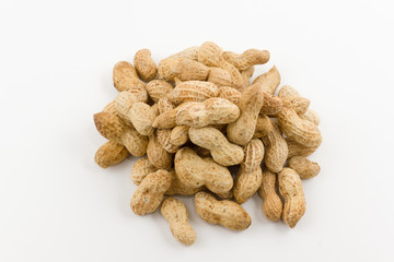 peanut hill in a shell lies on a white background