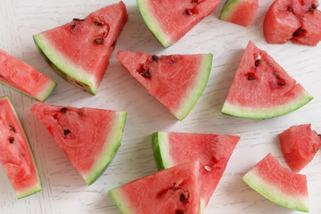 Sliced watermelon on wooden table closeup