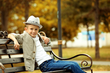 Little boy on bench in the park