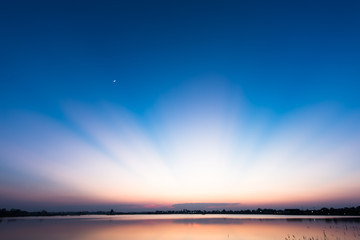 Wonderful sunlight after sunset over the lake