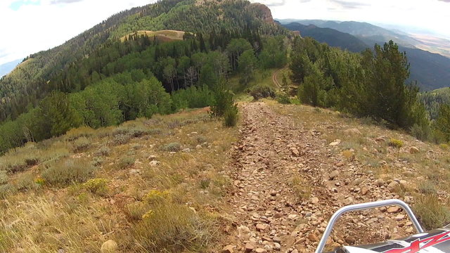 All terrain vehicle recreation drives down high mountain trail HD 0002