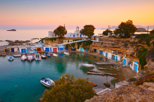 mall harbour with fishing boats in Mandrakia village on the northern coast of Milos island