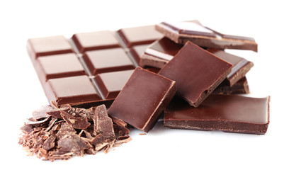 Black chocolate pieces isolated on white background