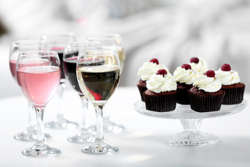 Tasting of wine and chocolate cupcakes, close up