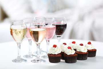 Tasting of wine and chocolate cupcakes, close up