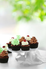 Beautiful chocolate cupcakes on table, close up