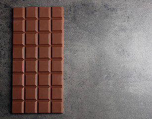 Chocolate bar on dark grey background