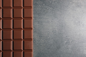 Chocolate bar on dark grey background