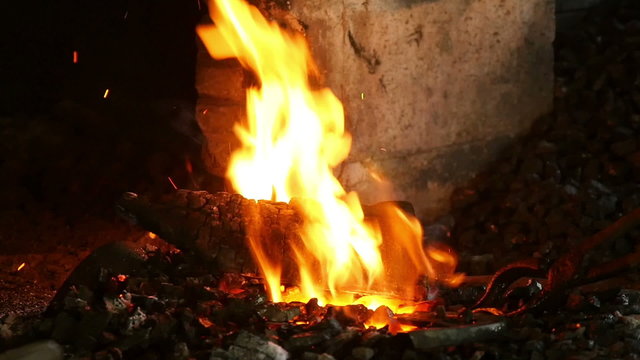 smith heats a horseshoe in the oven, slow motion 1