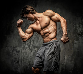Obraz na płótnie Canvas Awesome muscular man with great body.