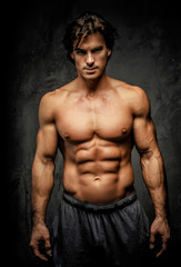 Fototapeta na wymiar Awesome muscular man with great body.