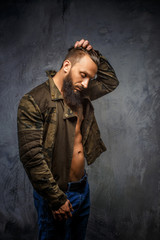 Brutal bearded man in casual clothing.