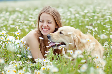 Beautiful girl with dog friend in a wild nature 