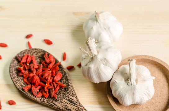 Dried goji berries on wooden tablespoon