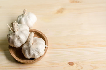 Fresh garlic on white wooden table, selective focus