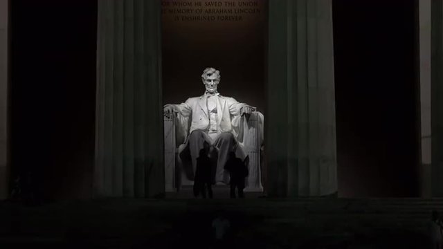Lincoln Monument night sit on chair tourists 4K 019
