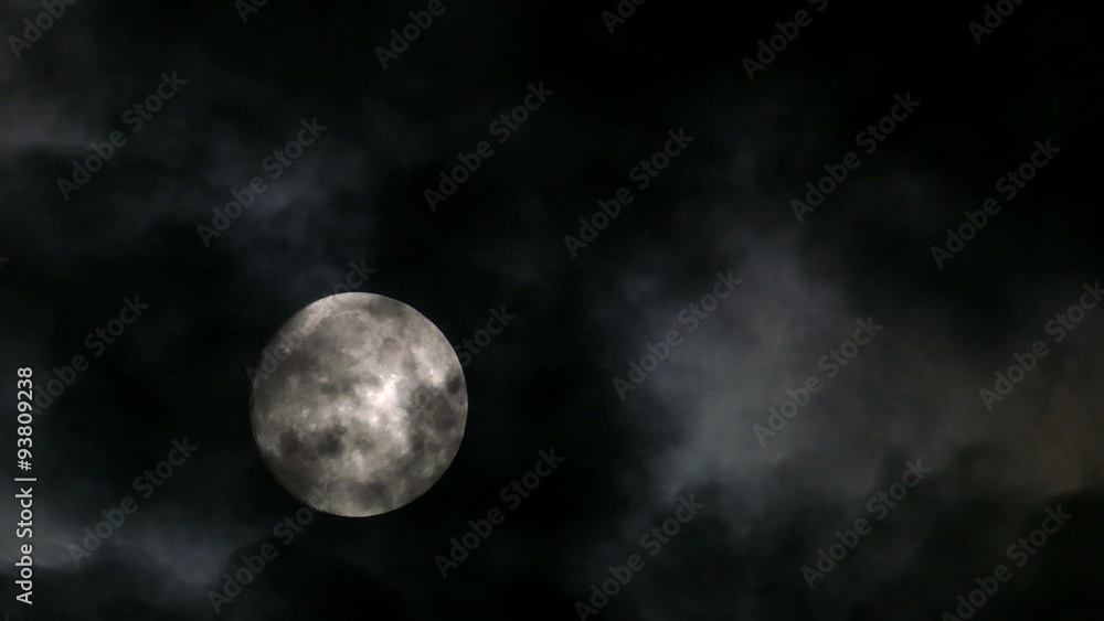 Wall mural timelapse with full moon moving between clouds