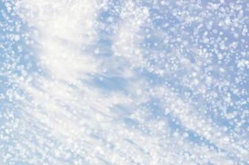 Obraz premium Falling snowflakes on blue background