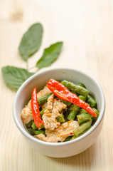 Spicy stir fried pork with red curry paste and Yard Long bean, T