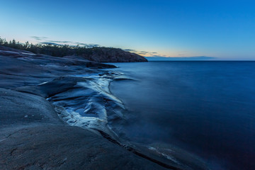 Blue evening on the sea rocky coast, Finland, Åland