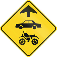 Canadian road warning sign - ATVs and cars ahead. This sign is used in Quebec