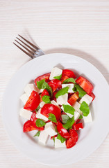 salad with cheese, tomatoes and basil