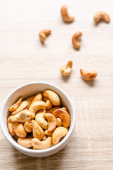 Close up cashew nuts on wooden background