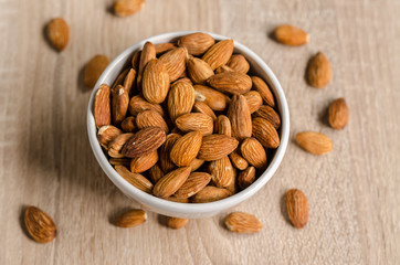 Almond Nuts on wooden background