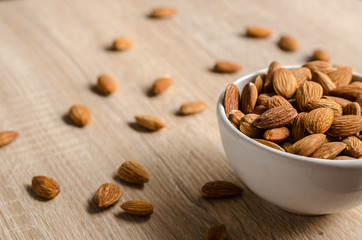 Almond Nuts on wooden background
