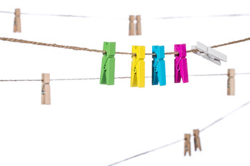 colorful clothespins on a clothesline , clamp peg housework