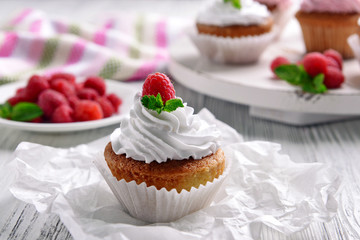 Delicious cupcake with berries on table close up