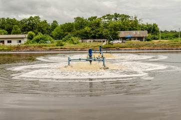 Fototapeta na wymiar surface aerators in waste water pond at landfill site use for ma