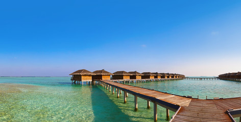 Bungalows on tropical Maldives island