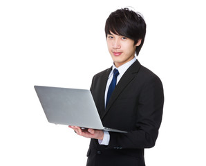 Businessman use of the notebook computer