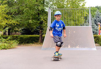 Young boy skateboarding at the park