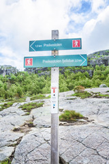 Directing sign to Preikestolen Rock. Hiking trail and alpine landscape of the Preikestolen and Lysefjord area in Rogaland, Norway