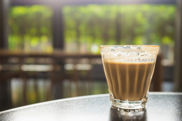 Cup of coffee on wooden table