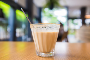 Cup of coffee on wooden table