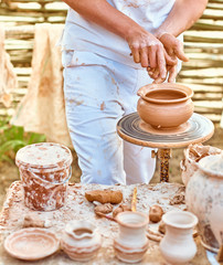 Ethnic art, skilled master creating pot of clay, ceramic, craft