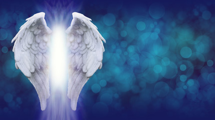 Angel Wings on Blue Bokeh Banner    - Wide blue bokeh background with a large pair of Angel Wings on the left side and a shaft of bright light between