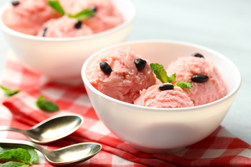 Watermelon ice cream in bowls  on color wooden background