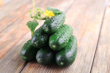 Cucumbers on wooden background
