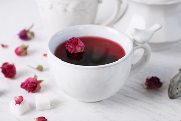Obraz na płótnie Canvas Tea set and rose tea on table