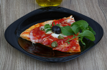 Pizza with salami and mozzarella