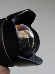 Wideangle camera lens with reflections closeup